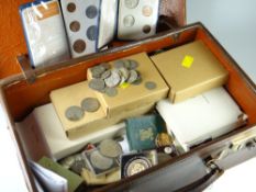 A small leather suitcase containing large collection of pre-decimal currency, commemorative crowns &