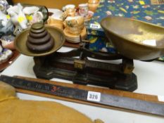 A vintage Carnegie & Layton, Birmingham weighing scales & three vintage wooden imperial rulers