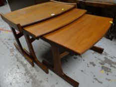A nest of three G-Plan style tables