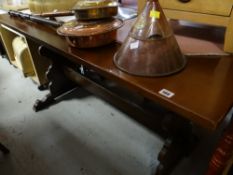 A vintage oak refectory-style dining table