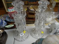 A pair of Baccarat, Paris lustre candlestick holders