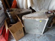 A pair of vintage industrial floodlights together with a large vintage cathode ray tube bulb