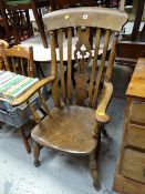 A good elm seated antique Windsor armchair with carved splat