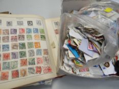A vintage stamp album & parcel of loose stamps