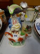 A Royal Doulton character-ware tall jug, a Brannamware Toby Jug & Staffordshire cow creamer