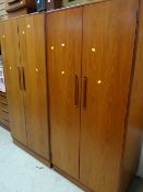 Two G-Plan double wardrobes together with a bedside cabinet & a chest of drawers