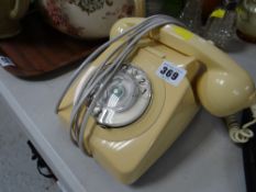 A vintage BT two-piece telephone in cream