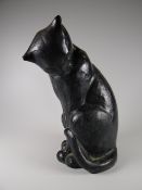 A stone pottery model of a black cat