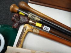 Four vintage walking sticks