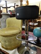 A chrome & black leather effect kitchen stool together with a circular bedroom chair