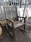 A wooden garden rocking chair (outside)