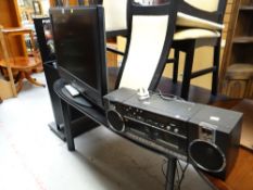 A Sony Bravia flatscreen TV together with a Panasonic music system E/T