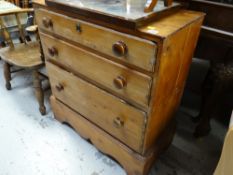 A vintage chest of three graduated drawers