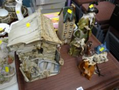 A pottery house together with figures of wizards & warlocks