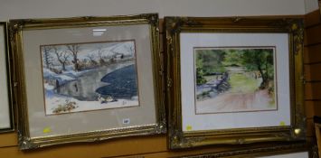A watercolour of a lake in winter with swans together with another modern framed print