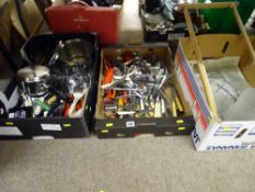 Two boxes of kitchen cutlery and a box of household lighting etc