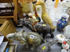 Porcelain elephants including a Dux model, heavy duck ornament, cockerel etc