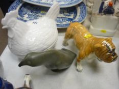 Inuit mineral carving of a sea bird, hen on nest and a bulldog ornament