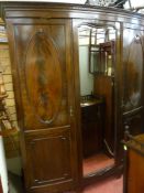 Mahogany bow front three door wardrobe