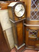 Polished wooden grandmother clock