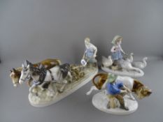 Three Spanish porcelain models of rural figurines and animals (damages)
