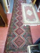 Red patterned runner and another