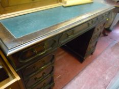 Twin pedestal desk with tooled top and fielded panelled drawers