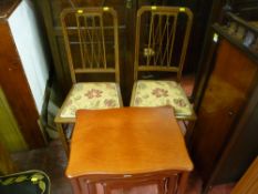 Modern nest of three tables and two chairs with floral upholstered seat pads