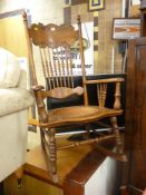 Carved back leather effect seated rocking chair