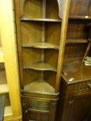 Compact corner unit with upper shelves and base cupboard