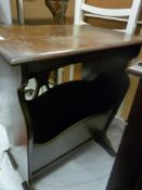 Polished wood magazine rack/table having carved detail