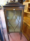 Single door china cabinet on raised supports