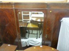 Large mahogany three door wardrobe over two base drawers
