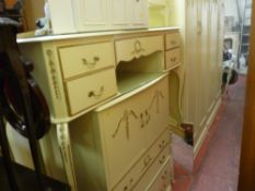 Cream Continental bedroom suite of twin wardrobes, chest of drawers, dressing table etc