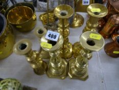 Two pairs of Victorian brass candlesticks with others