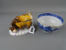18th Century blue and white pagoda pattern tea bowl and a 19th Century fairing type box and cover