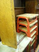 Six stacking wooden seated metal stools and a bench stool