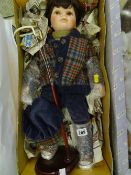 Boy golfer doll on stand with hat and clubs (boxed)