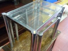 Set of three chrome and glass occasional tables