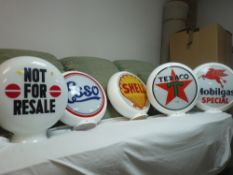 Parcel of four replica petrol pump globes by Texaco, Mobil Gas, Shell, Esso and a glass 'Not For