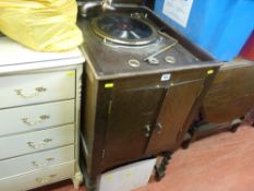 Vintage record player in wooden case with integral speaker and a quantity of records