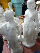 Pair of standing maiden garden ornaments
