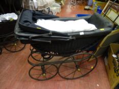 Metal and wicker hooded dolls' pram with white silk coverings