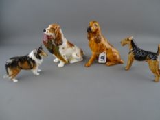 Royal Doulton spaniel with pheasant HN1028, two further Doulton dogs and a Coalport figure of a