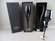 Two stylish Waterford champagne flutes by John Rocha