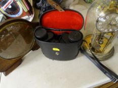 Polished mantel clock, boule clock under a glass dome and a cased set of binoculars