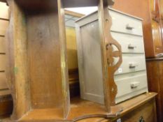 Small painted four drawer chest and a wall hanging three shelf bookcase