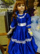 Doll with red hair and long blue dress
