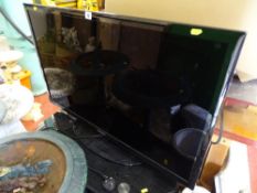 Samsung flatscreen 40 ins TV with stand E/T