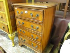 Small four drawer mahogany inlaid chest